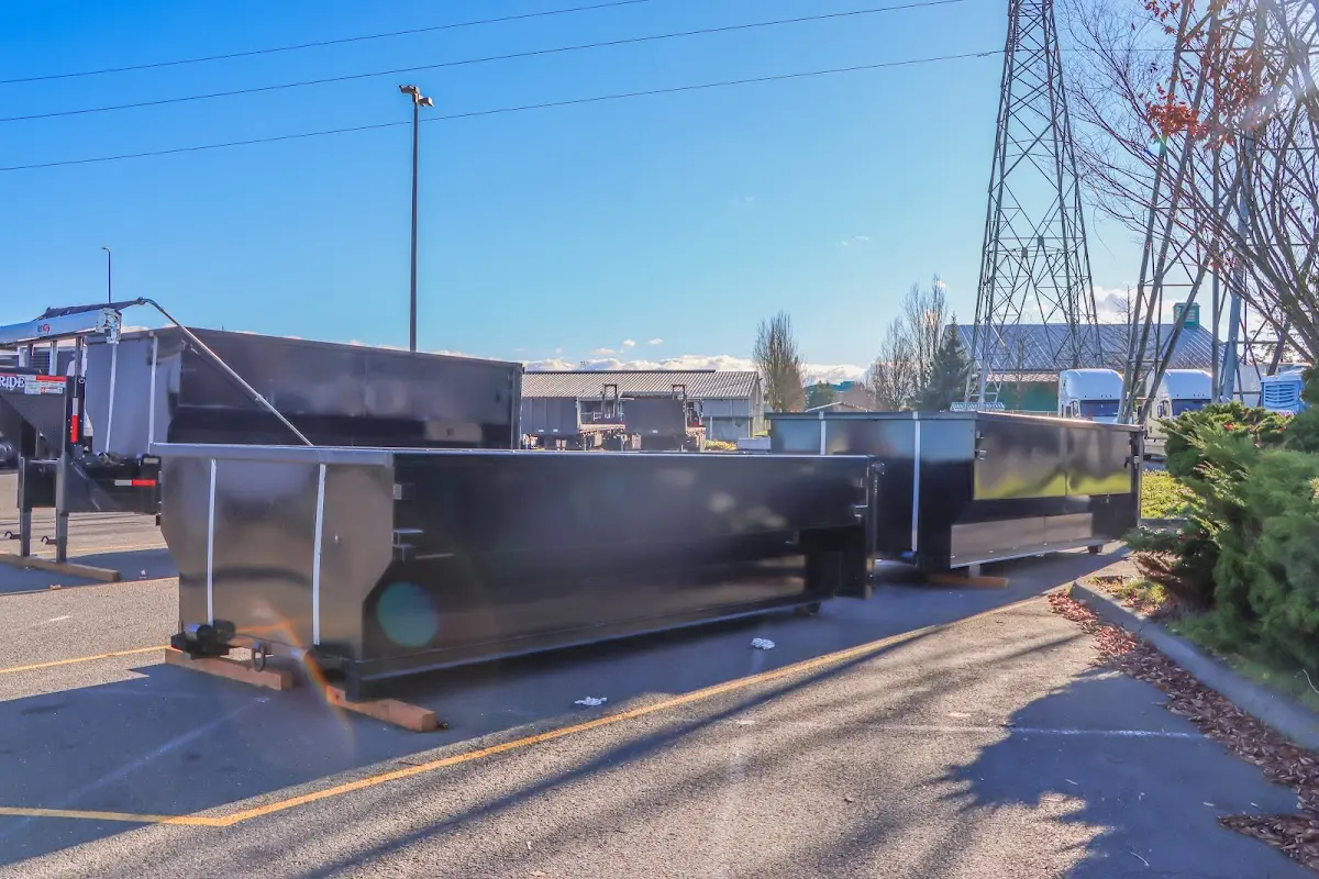 Roll-off dumpster ready for waste disposal at job site for 3 Yard Dumpster Rental in Maynard